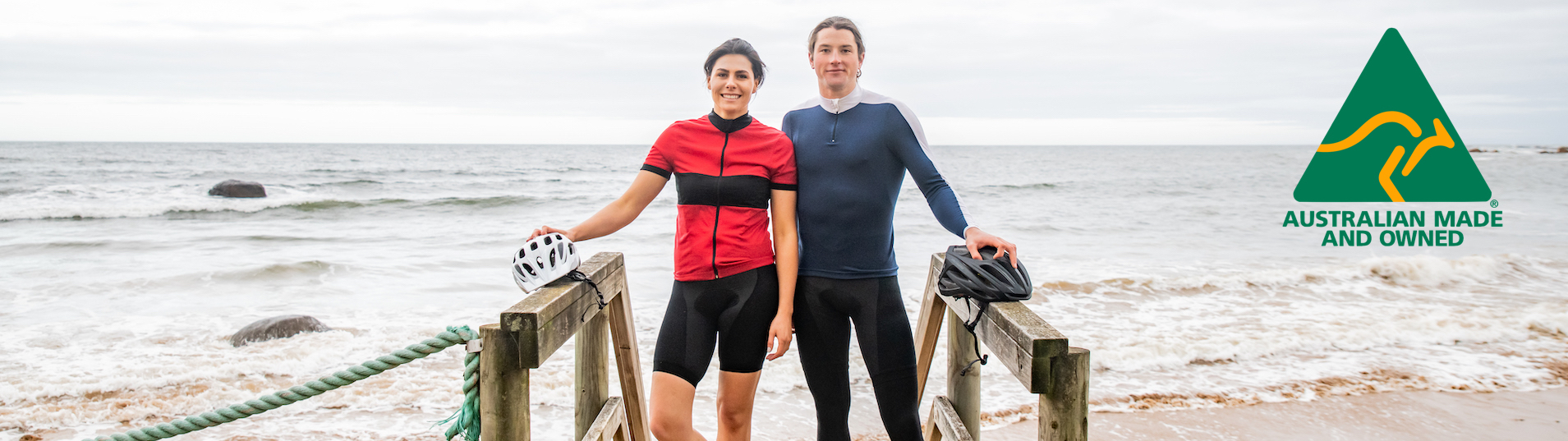 Long sleeve 100% Wool Sidling winter jersey full length zip front view male and female model standing with ocean in background